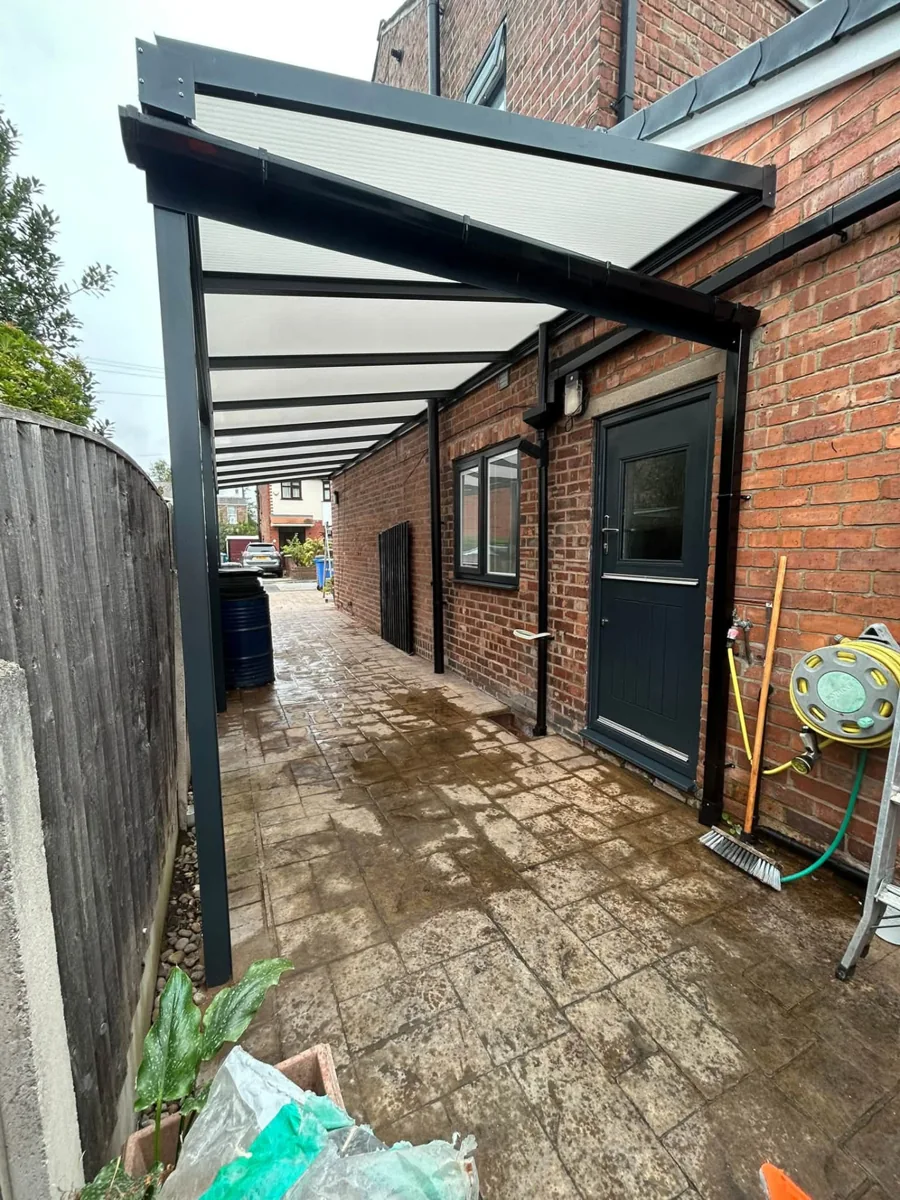 Canopy providing shelter over a side entrance